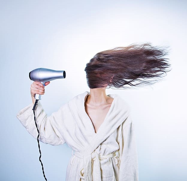 woman-hair-drying. How to stop hair loss