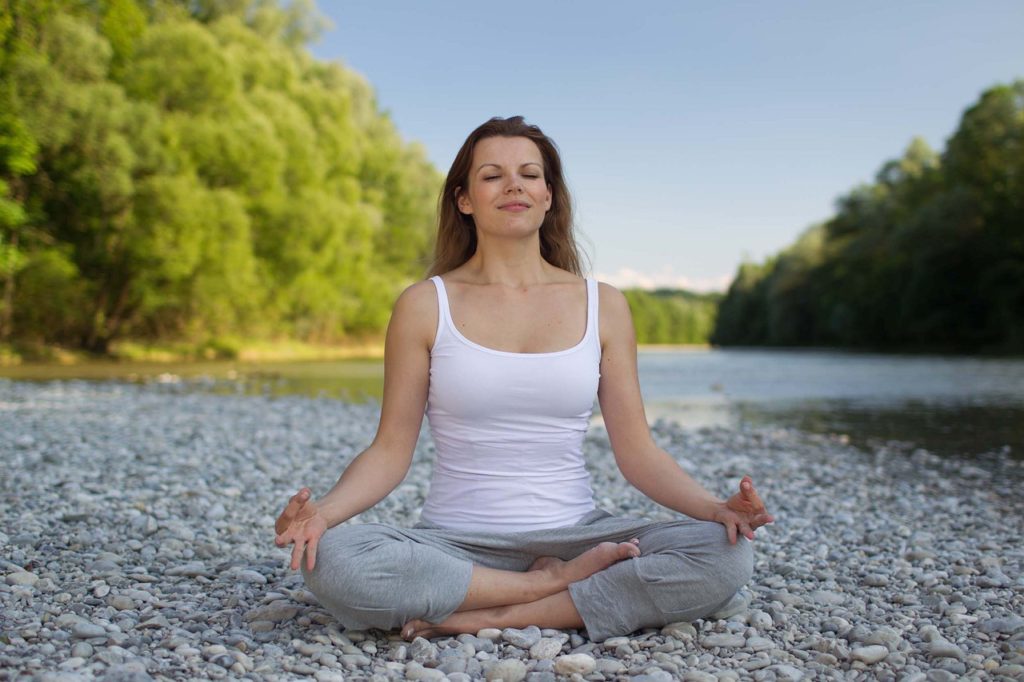 woman meditating. how to stop acne 4