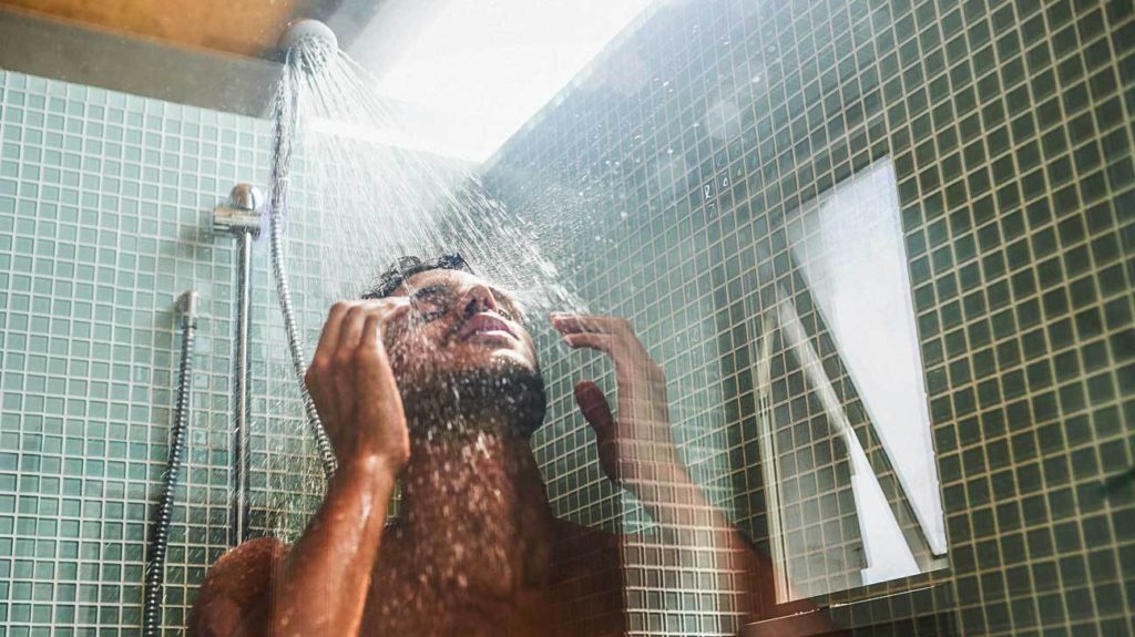 man in a warm shower. cough home remedies 3