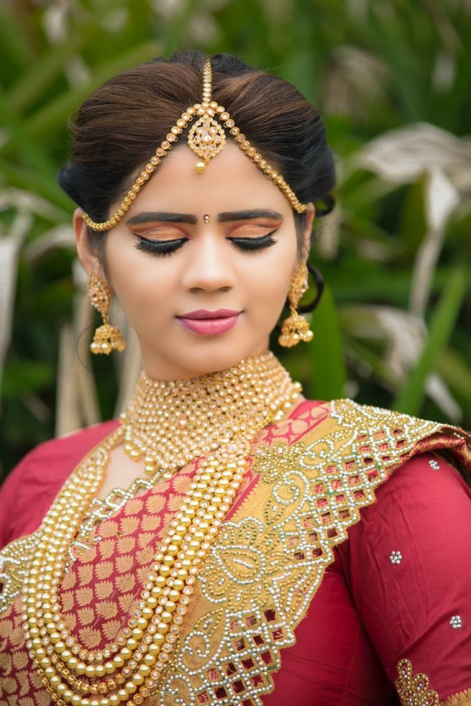 woman dressed in gold jewellery