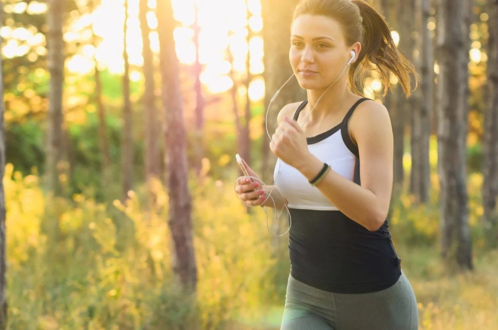 woman jogging at sunrise